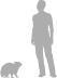 Bush Hyrax shown next to a 6 ft (1.8 m) person for scale