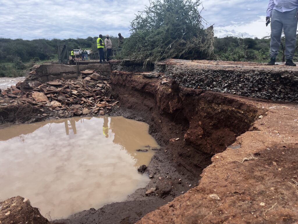 A damaged road after a bridge.