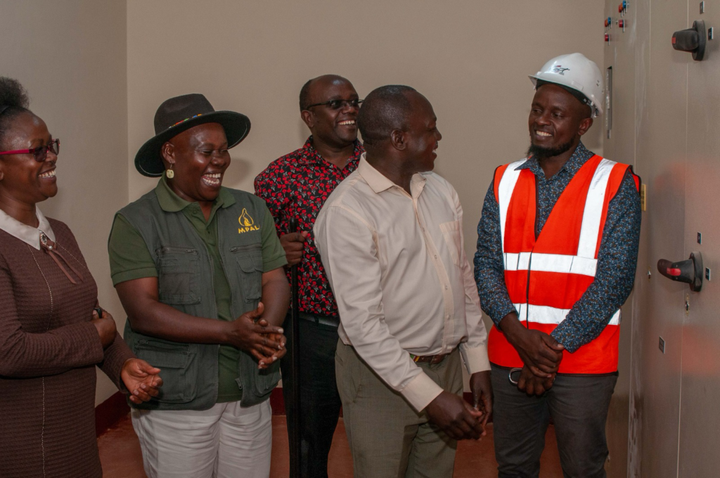 Mpala, Laikipia County, and CAT staff in the room housing the batteries and inverters.